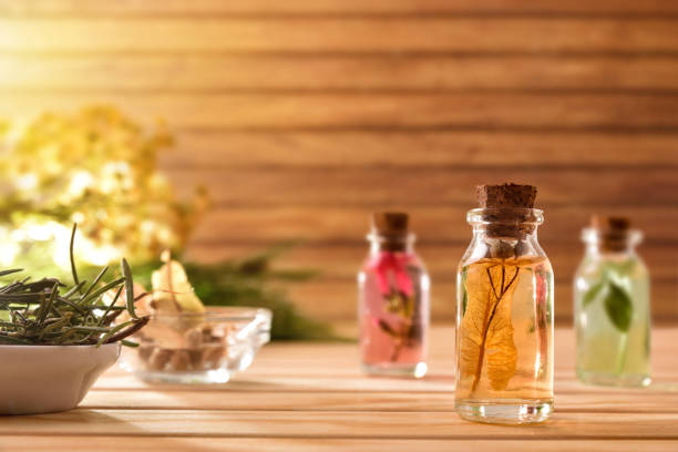 istock Jars with plant and essence inside on table wooden background 1192284379