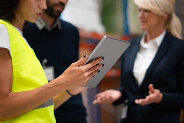istock Managers checking the list of products 1192284443