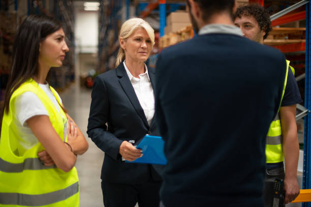 istock Warehouse staff meeting, workers with mnagers 1192285018