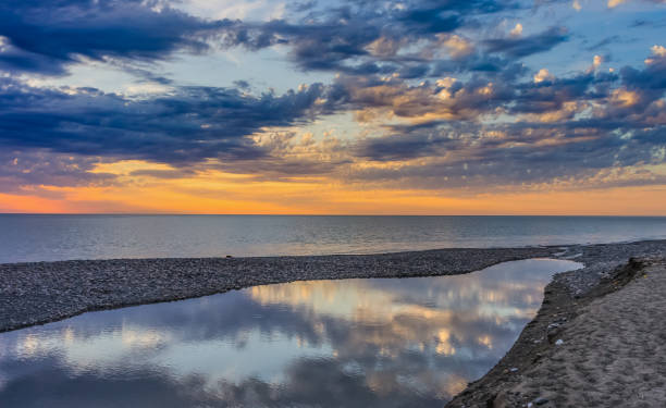 istock Beautiful orange sunset over the sea and river 1192285403