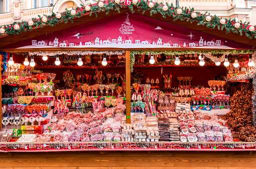 Sibiu, Romania - 3 December, 2019; color image depicting a huge selection of candy and sweets on display and for sale on a market stall at a Christmas market in Sibiu, a city in the Transylvania region of Romania. The candy on display includes candy canes, nougat and a selection of lollipops.