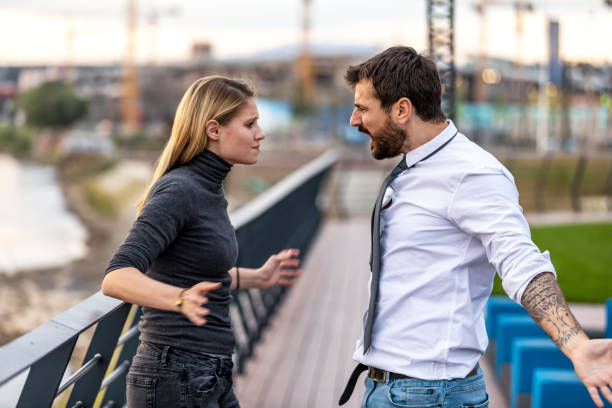istock Handsome Man is Arguing with his Girlfriend Near the River 1192286080
