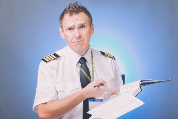 istock Pilot filling in logbook and checking papers 1192289756