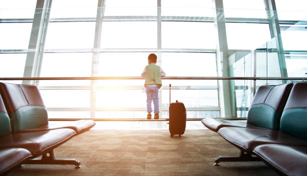 istock Little asian boy at airport 1192289850