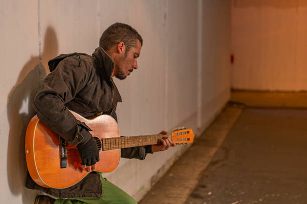 istock Street Performer with Guitar in the Subway 1192290574