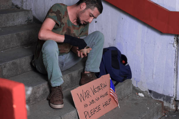 istock War Veteran is Sitting on the Stairs and Begging for Help 1192290680