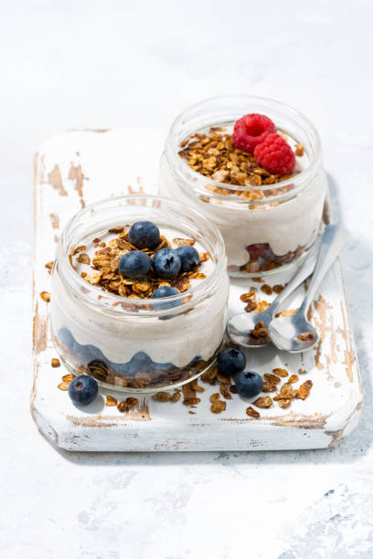 istock healthy creamy dessert with berries, vertical 1192290888