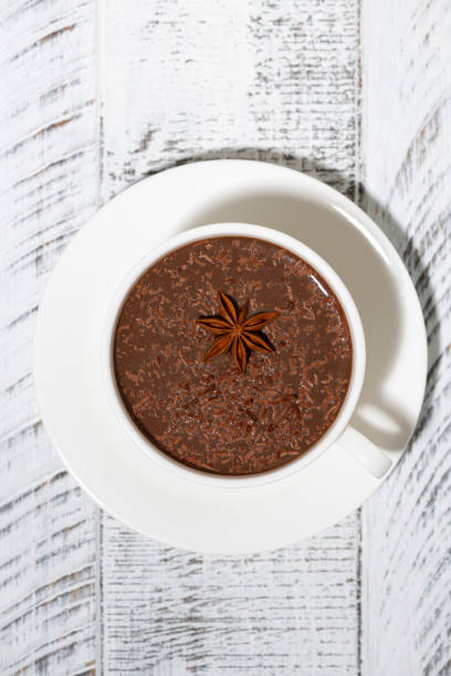 istock cup of hot spiced chocolate on white background, vertical 1192290994