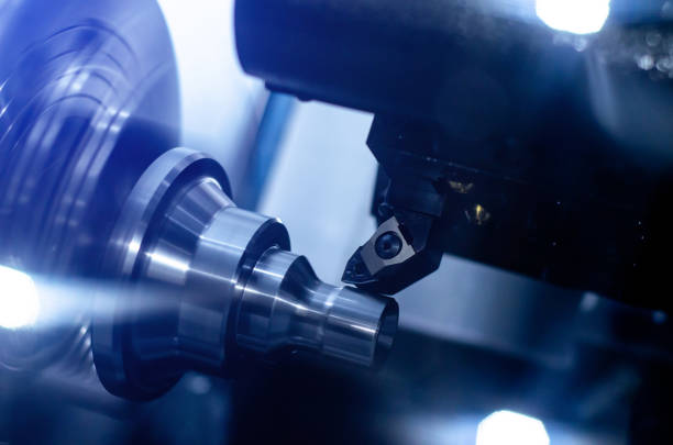 istock The CNC lathe machine in metal working process. 1192298917