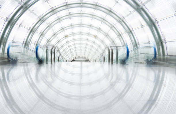 istock Tunnel walkway in a modern office building 1192301399
