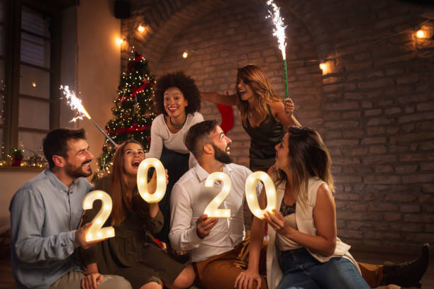 istock Friends having fun at New Year party 1192301568