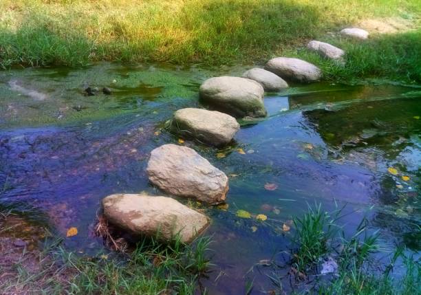 The River In Which Route Has Been Made. The river is very clear. The route is made up of Stone.