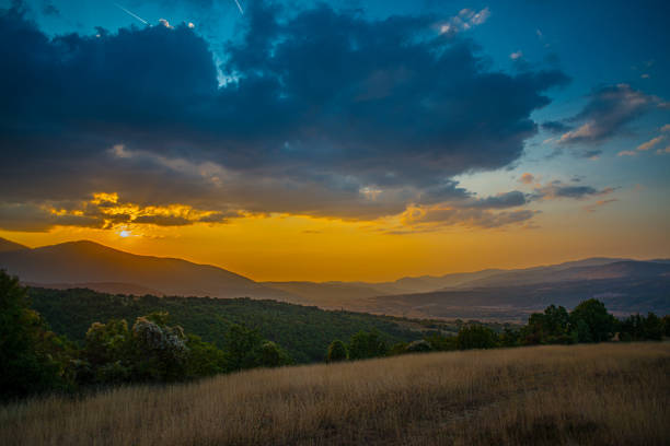 The sunset above the mountain landscape\