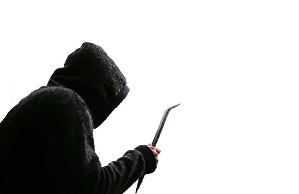 Criminal with crowbar near the doors. Robber in dark hoodie. Isolated on white background. Criminal with crowbar near the doors. Robber in dark hoodie. Isolated on white background. burglary crowbar stock pictures, royalty-free photos & images