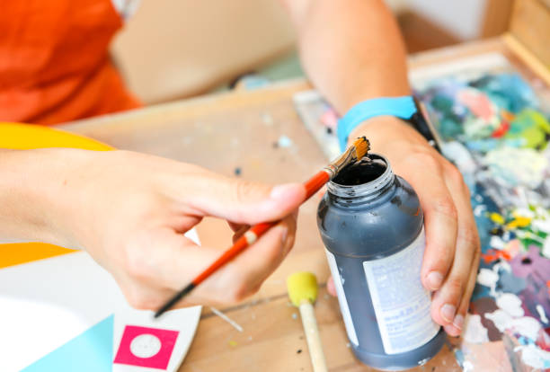 istock Real work studio of the painter. Man is creating picture. Artist concept. Creative atmosphere. Paint brushes. 1192303784