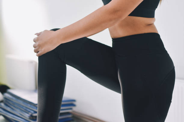 istock Woman doing stretching workout at gym 1192304994