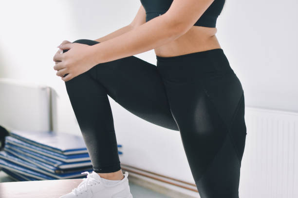 istock Woman doing stretching workout at gym 1192305039
