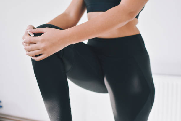 istock Woman doing stretching workout at gym 1192305091