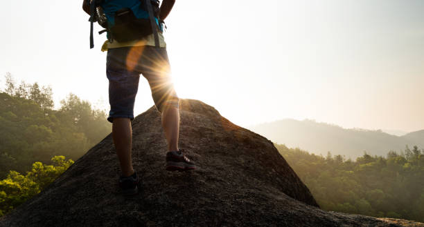 istock Male backpacker walking on mountain peak 1192306626