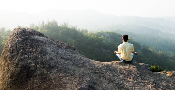 istock Meditation on the top of mountain 1192307175