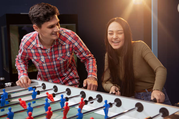istock Couple playing foosball 1192308056