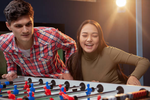 istock Couple playing foosball 1192308166