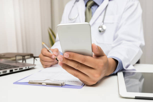 istock Medic working with modern smart phone, Medical network concept. 1192309420