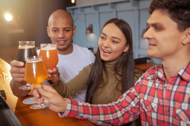 istock Diverse group of friends drinking at the pub 1192309499