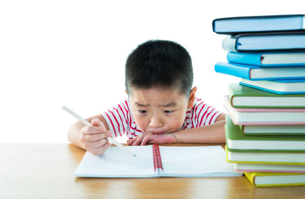 istock Asian boy with books against white background 1192310773
