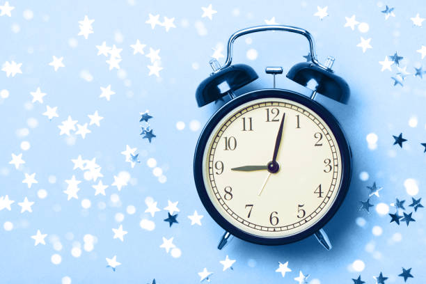 istock Alarm clock on the blue background 1192310838