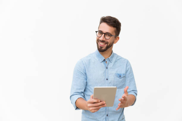 istock Happy joyful guy with tablet getting good news 1192310993