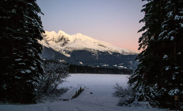 Frozen Lake A frozen lake and snow covered mountains in northern British Columbia. smithers british columbia stock pictures, royalty-free photos & images