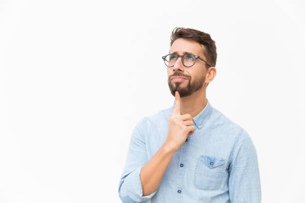 istock Positive pensive male customer studying special offer 1192311138