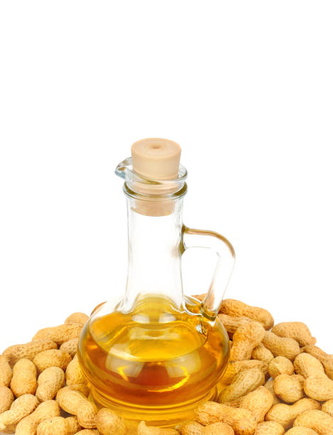 istock Peanut oil in a glass bottle with peanuts. 1192311753