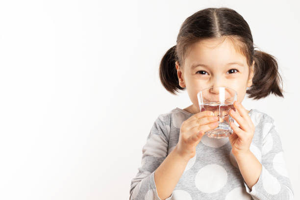 istock Girl Drinking Water 1192311812
