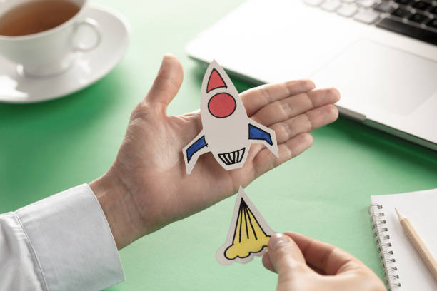 istock Business Person with Startup Rocket 1192311998