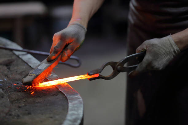 istock The process of manufacturing a craft product in a forge 1192312000