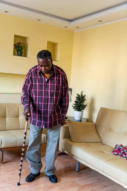 istock Older Afro-American with Walking Cane at Home 1192312226