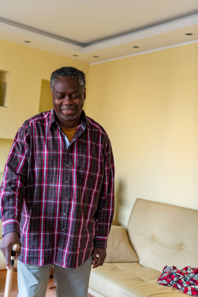 istock Older Afro-American with Walking Cane at Home 1192312245