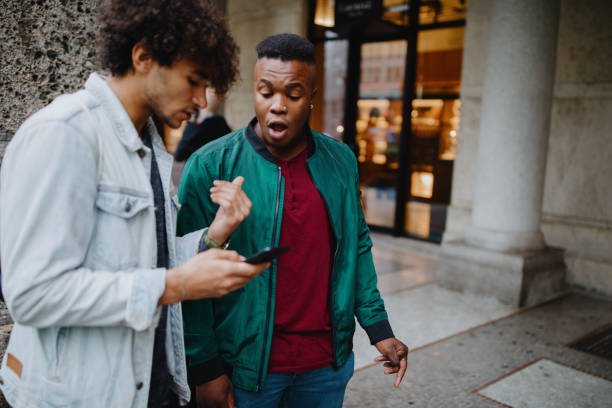 istock Millennials in the street with smartphone 1192313310
