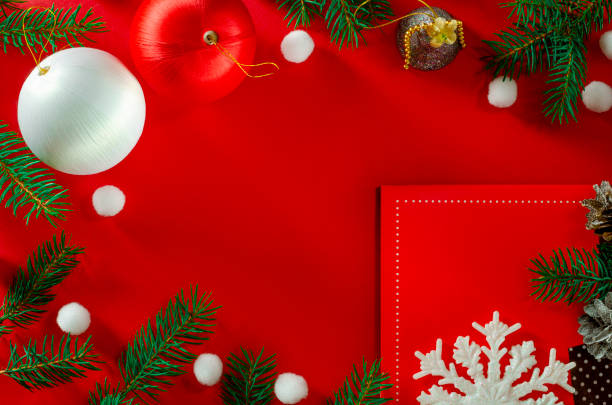 istock Frame of Christmas decoration on red background top view 1192313321