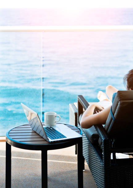 istock Woman working with a laptop on cruise ship 1192313781