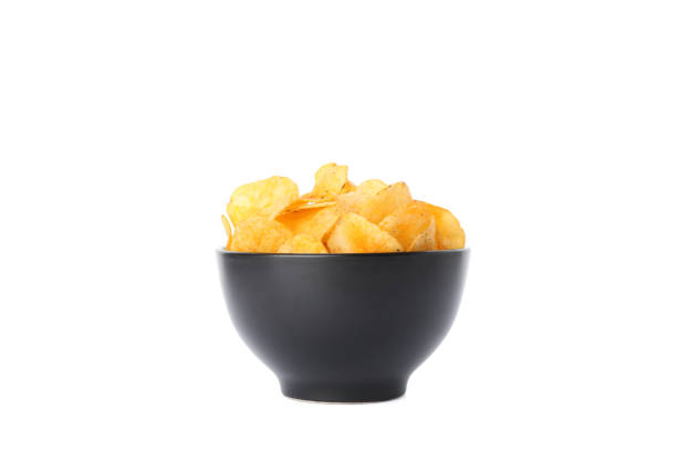 istock Potato chips in a black bowl isolated on white background, space for text 1192314853
