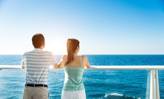 Young couple enjoying the view on cruise ship.