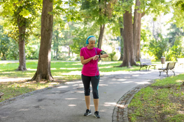 istock Mature Female Athlete is Checking her Pulse After Exercise 1192316353