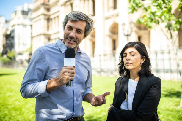istock Hispanic woman speaking to media 1192316578