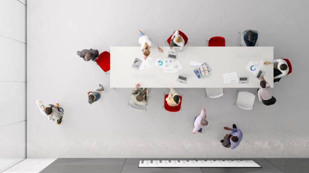 istock Overhead view of people in the office 1192317295