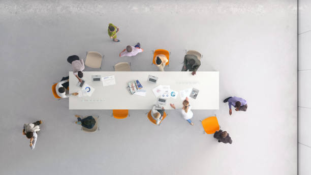 High angle view of people at work Overhead view of a group of people working in the office. All elements in the scene are 3D employee engagement photos stock pictures, royalty-free photos & images