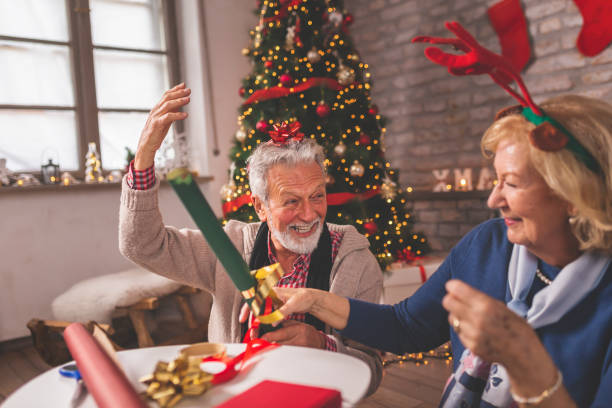 istock Senior couple wrapping Christmas presents 1192317602
