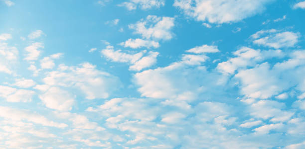 istock white Cumulus clouds in a blue sky 1192327776